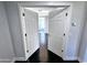Entryway with white double doors and hardwood flooring leading into a bright, modern interior at 3330 W Gran Paradiso Dr, Phoenix, AZ 85086