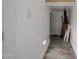Hallway featuring light wall and floor tiles with base trim lighting at 3330 W Gran Paradiso Dr, Phoenix, AZ 85086