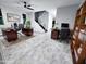 Spacious home office with gray floors, two wooden desks, and ample natural light at 3330 W Gran Paradiso Dr, Phoenix, AZ 85086