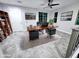 Well-lit home office with natural light, a spacious wooden desk, and comfortable leather seating at 3330 W Gran Paradiso Dr, Phoenix, AZ 85086