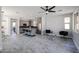 Open concept kitchen boasts gray cabinets, granite counters, an island with seating, and stainless steel appliances at 3330 W Gran Paradiso Dr, Phoenix, AZ 85086