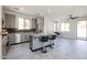 Spacious kitchen features gray cabinets, stainless steel appliances, granite countertops, and a center island with seating at 3330 W Gran Paradiso Dr, Phoenix, AZ 85086
