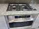 Close-up of the kitchen featuring stainless steel appliances including a gas cooktop and built-in oven at 3330 W Gran Paradiso Dr, Phoenix, AZ 85086