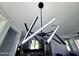 Modern kitchen light fixture is seen above a kitchen with dark cabinets and stainless steel appliances at 3330 W Gran Paradiso Dr, Phoenix, AZ 85086