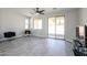 A well-lit living room with sliding doors to the backyard at 3330 W Gran Paradiso Dr, Phoenix, AZ 85086