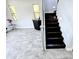 Bright living room with modern bar area, staircase, and two large windows at 3330 W Gran Paradiso Dr, Phoenix, AZ 85086