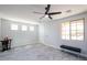 Modern living room with light gray floors, ample natural light, and minimalist decor at 3330 W Gran Paradiso Dr, Phoenix, AZ 85086