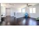 Spacious upstairs living room with ample natural light and hardwood floors at 3330 W Gran Paradiso Dr, Phoenix, AZ 85086