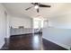 Bright upstairs living room with built-in cabinetry and desk under a ceiling fan at 3330 W Gran Paradiso Dr, Phoenix, AZ 85086