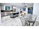 Bright open-concept living space seamlessly connects the kitchen, living room, and dining area at 3330 W Gran Paradiso Dr, Phoenix, AZ 85086