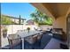Covered patio boasts ample seating, modern dining table, and a cozy lounge area ideal for relaxing and entertaining at 3330 W Gran Paradiso Dr, Phoenix, AZ 85086