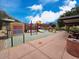 Community playground featuring colorful equipment, slides, and climbing structures, perfect for Gathering fun and recreation at 3330 W Gran Paradiso Dr, Phoenix, AZ 85086