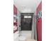 Bright bathroom featuring a white shower-over-tub with updated fixtures and black tile at 3544 E Fox St, Mesa, AZ 85213