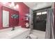 Bright bathroom featuring a white vanity, framed mirror, and shower-over-tub with updated fixtures at 3544 E Fox St, Mesa, AZ 85213