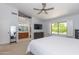 Spacious bedroom with a large window offering views of the landscaped backyard at 3544 E Fox St, Mesa, AZ 85213