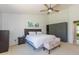 Spacious bedroom with a large window offering views of the landscaped backyard at 3544 E Fox St, Mesa, AZ 85213