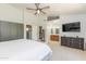 Spacious bedroom with a large window offering views of the landscaped backyard at 3544 E Fox St, Mesa, AZ 85213