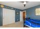 Bedroom features a ceiling fan, closet space and carpet floors, offering a serene space at 3544 E Fox St, Mesa, AZ 85213