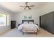 Spacious bedroom with a large window offering views of the landscaped backyard at 3544 E Fox St, Mesa, AZ 85213