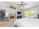 Spacious bedroom with a large window offering views of the landscaped backyard at 3544 E Fox St, Mesa, AZ 85213