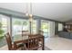 Dining area with stylish light fixture and view of the backyard at 3544 E Fox St, Mesa, AZ 85213