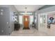 Inviting foyer featuring tile flooring and a view into a bright living space at 3544 E Fox St, Mesa, AZ 85213