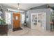 The foyer features a wood front door, tile floors, and an open floor plan at 3544 E Fox St, Mesa, AZ 85213