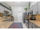 Bright kitchen features stainless steel appliances, granite countertops, and ample cabinets for storage at 3544 E Fox St, Mesa, AZ 85213