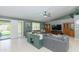 Open-concept living room with tile floors and a view of the backyard at 3544 E Fox St, Mesa, AZ 85213