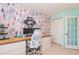Bright and colorful office space features a large window and custom shelving at 3544 E Fox St, Mesa, AZ 85213