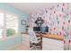 Bright and colorful office space features a large window and custom shelving at 3544 E Fox St, Mesa, AZ 85213