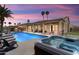 Resort-style backyard with a pool, spa, covered patio, and a built-in grill perfect for entertaining at 3797 N 156Th N Dr, Goodyear, AZ 85395