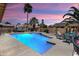 Sparkling pool and spa surrounded by lush landscaping offering a private backyard oasis at 3797 N 156Th N Dr, Goodyear, AZ 85395
