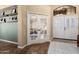 Inviting entryway with a glass door office, tile flooring, and natural light at 3797 N 156Th N Dr, Goodyear, AZ 85395