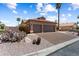Inviting home with desert landscaping, including cacti and flowering bushes, enhancing curb appeal at 3797 N 156Th N Dr, Goodyear, AZ 85395