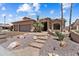 Well-maintained home with desert landscaping, stone walkway, and ample two-car garage at 3797 N 156Th N Dr, Goodyear, AZ 85395