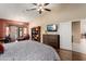 Spacious main bedroom features hardwood floors, private ensuite bath, and seating area at 3797 N 156Th N Dr, Goodyear, AZ 85395