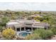 An elevated perspective showcasing desert landscaping, a private pool, a patio, and scenic views at 39847 N 105Th Pl, Scottsdale, AZ 85262