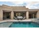 Inviting backyard with a swimming pool, spa, and outdoor seating area at 39847 N 105Th Pl, Scottsdale, AZ 85262