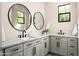 Stylish bathroom featuring double sinks, marble countertops, and modern fixtures at 39847 N 105Th Pl, Scottsdale, AZ 85262