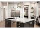 Granite kitchen island with stainless steel appliances and pendant lights at 39847 N 105Th Pl, Scottsdale, AZ 85262