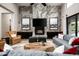 Cozy living room with a stone fireplace, comfortable seating, and stylish decor at 39847 N 105Th Pl, Scottsdale, AZ 85262