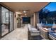 Relaxing outdoor patio featuring a fire pit, ample seating, a spa, and a view of desert landscaping at 39847 N 105Th Pl, Scottsdale, AZ 85262