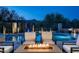 Inviting pool area featuring comfortable seating, a fire pit, and stunning mountain views in the background at 39847 N 105Th Pl, Scottsdale, AZ 85262