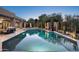 Outdoor oasis with a sparkling pool, spa, desert landscaping, and seating areas for relaxation at 39847 N 105Th Pl, Scottsdale, AZ 85262