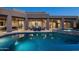 Luxurious pool and patio with outdoor dining, spa, and lush desert landscaping for ultimate relaxation at 39847 N 105Th Pl, Scottsdale, AZ 85262