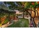 Serene backyard blending lush greenery, desert plants, and views of the desert landscape at 41590 N 108Th St, Scottsdale, AZ 85262