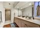 Bright bathroom featuring a double vanity, walk-in shower, and modern fixtures at 41590 N 108Th St, Scottsdale, AZ 85262