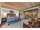 Spacious bedroom featuring a wood-paneled ceiling, king bed, and access to an outdoor patio at 41590 N 108Th St, Scottsdale, AZ 85262