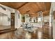 Open dining room area with hardwood floors, wooden ceilings, and views of the exterior at 41590 N 108Th St, Scottsdale, AZ 85262